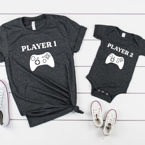 Player 1 and Player 2 dad son matching shirts